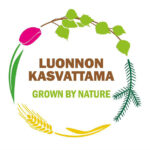 Logossa pyöreänä kehänä tulppaani, koivun ja männyn oksat ja viljan tähkä. Keskellä teksti Luonnon kasvattama Grown by nature.